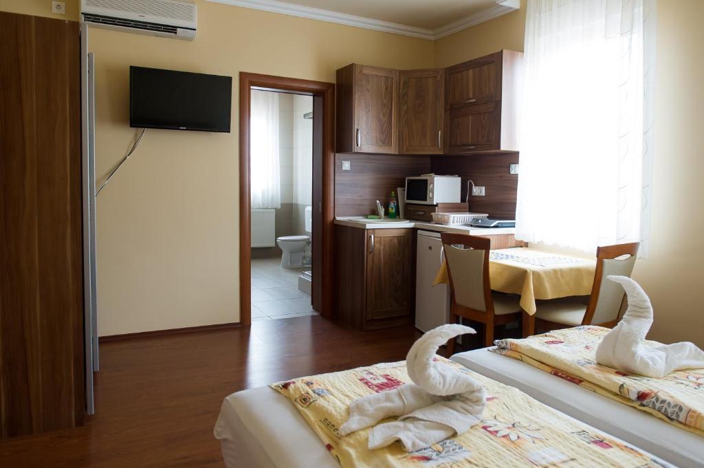 Aura Apartman ハイデゥソボスロー 部屋 写真